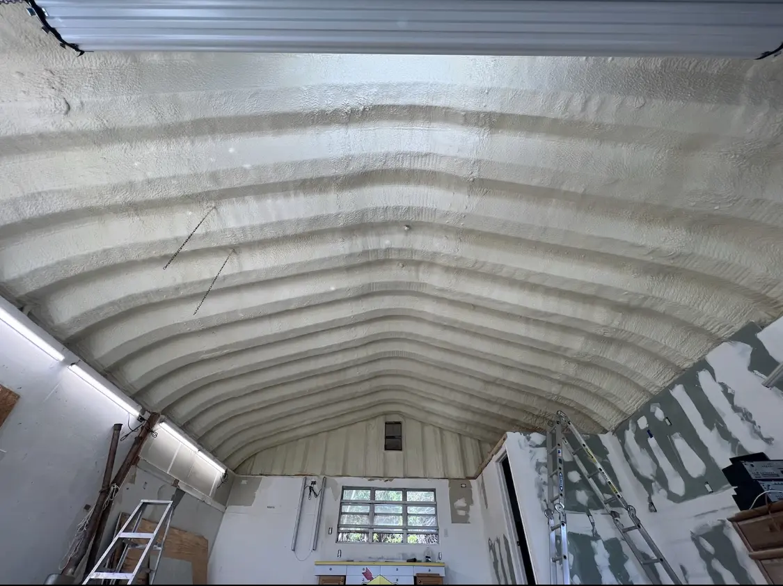 Spray polyurethane foam applied to the underside of a metal roof deck in Lower Heidelberg